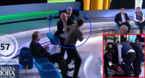 지난 18일(현지 시각) 토론 중 친러시아 성향의 야당 소속 네스토르 슈프리치 의원과 유리 부투소프 기자가 몸싸움을 벌이고 있다. /유튜브