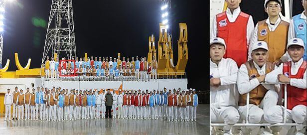 북한 노동당 기관지 노동신문은 22일 전날인 21일 밤 발사한 군사정찰위성의 발사가 성공적으로 이뤄졌다고 주장했다. 김정은 총비서와 작업자들이 함께 찍은 단체 사진에서 러시아 기술자로 보이는 인물(왼쪽 빨간 사각형-오른쪽 확대 사진)이 포착됐다./노동신문 뉴스1